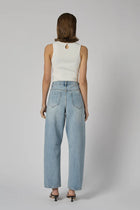 DRICOPER | ZELLA BARREL RODEO JEANS

A high-rise Barrel Jeans crafted from sturdy 100% Cotton Denim. A relaxed curved leg that continues to the ankle and gives an elevated look if styled with heel or pointy flats.

Available colours : Rodeo Blue &amp; Sunbleach

Model Wears Size 8/Small and is 176cm tall

Composition: 100% Cotton Denim