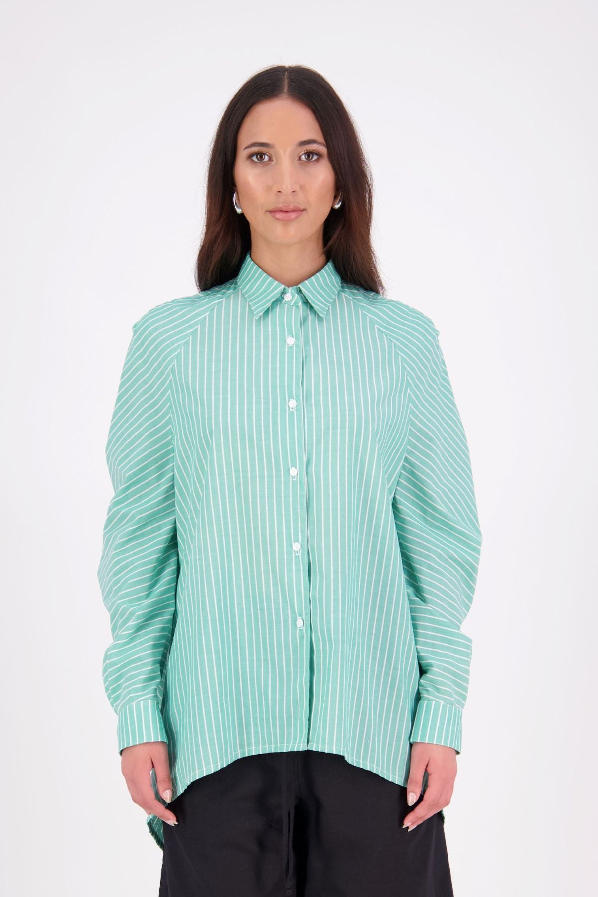 Zola cotton Shirt – Effortless Volume, Elevated Detail

The N-E-S Zola Shirt is a kimono-style oversized shirt with a relaxed, modern silhouette. Featuring a horizontal drop-back panel for added movement, 7/8 sleeves, a classic collar, centre front button placket, and button-up cuffs. A versatile piece that blends structure with flow—perfect for layering or wearing as a statement on its own.