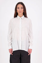 Zola cotton Shirt – Effortless Volume, Elevated Detail

The N-E-S Zola Shirt is a kimono-style oversized shirt with a relaxed, modern silhouette. Featuring a horizontal drop-back panel for added movement, 7/8 sleeves, a classic collar, centre front button placket, and button-up cuffs. A versatile piece that blends structure with flow—perfect for layering or wearing as a statement on its own.