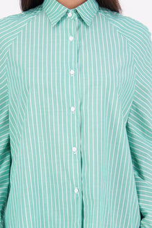 Zola cotton Shirt – Effortless Volume, Elevated Detail

The N-E-S Zola Shirt is a kimono-style oversized shirt with a relaxed, modern silhouette. Featuring a horizontal drop-back panel for added movement, 7/8 sleeves, a classic collar, centre front button placket, and button-up cuffs. A versatile piece that blends structure with flow—perfect for layering or wearing as a statement on its own.