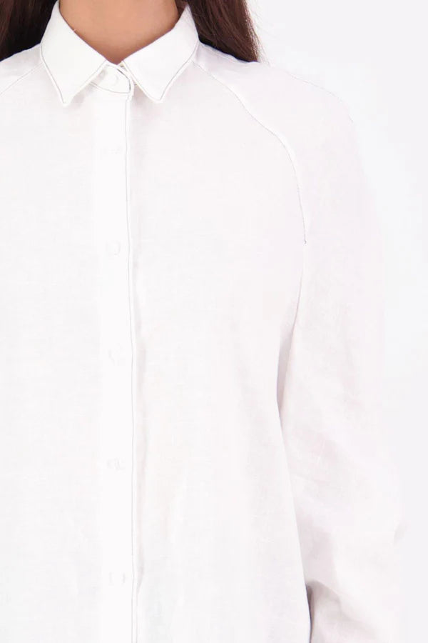 Zola cotton Shirt – Effortless Volume, Elevated Detail

The N-E-S Zola Shirt is a kimono-style oversized shirt with a relaxed, modern silhouette. Featuring a horizontal drop-back panel for added movement, 7/8 sleeves, a classic collar, centre front button placket, and button-up cuffs. A versatile piece that blends structure with flow—perfect for layering or wearing as a statement on its own.