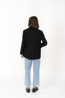 The Cosmo Blazer will instantly add effortless sophistication to any outfit! Lightweight enough to not feel heavy or restrictive but will still provide that extra layer of warmth. We love wearing her with jeans and a white tee for a chic weekend look, or pair with a pant or skirt to create a classic suit for days in the office.

Smart casual blazer with a soft, boxy silhouette.
Small subtle shoulder pads.
Lined collar with fold back lapel.
Lightweight, soft, stretch fabric with beautiful drape.
Functional p
