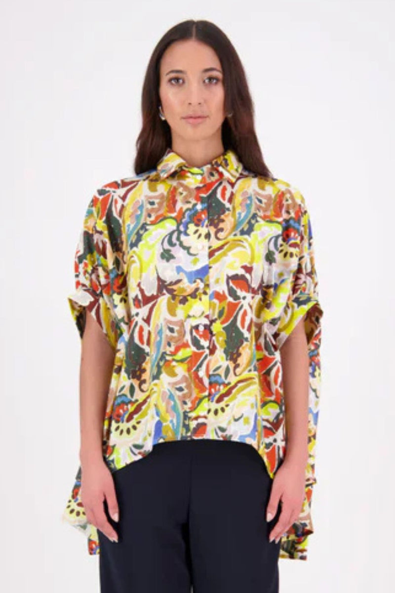 Ryn Shirt – Effortless Volume &amp; Soft Structure

The N-E-S Ryn Shirt is a COTTON SHIRT modern take on a classic, crafted in breathable cotton. With its umbrella-style silhouette, it features a centre front button-down placket, kimono-style sleeves gathered into soft cuffs, and a slight high-low hem. Easy to style back with pants, shorts, or skirts—this is your go-to shirt for relaxed yet elevated dressing.