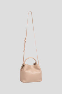 Introducing the ALEO Bon Bon Crossbody Bag, a beautiful fusion of craftsmanship, sustainability, and timeless design. Handcrafted with precision, this bag embodies the essence of slow fashion, using 100% traceable leather for a transparent and ethical approach to luxury. The genuine soft-grained leather finish offers a rich, tactile experience, enhancing both its durability and beauty over time. Genuine soft grained leather finish&nbsp;
Tote shaped bag w/ tonal handle
Detachable tonal crossbody strap