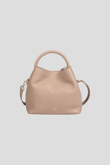 Introducing the ALEO Bon Bon Crossbody Bag, a beautiful fusion of craftsmanship, sustainability, and timeless design. Handcrafted with precision, this bag embodies the essence of slow fashion, using 100% traceable leather for a transparent and ethical approach to luxury. The genuine soft-grained leather finish offers a rich, tactile experience, enhancing both its durability and beauty over time. Genuine soft grained leather finish&nbsp;
Tote shaped bag w/ tonal handle
Detachable tonal crossbody strap