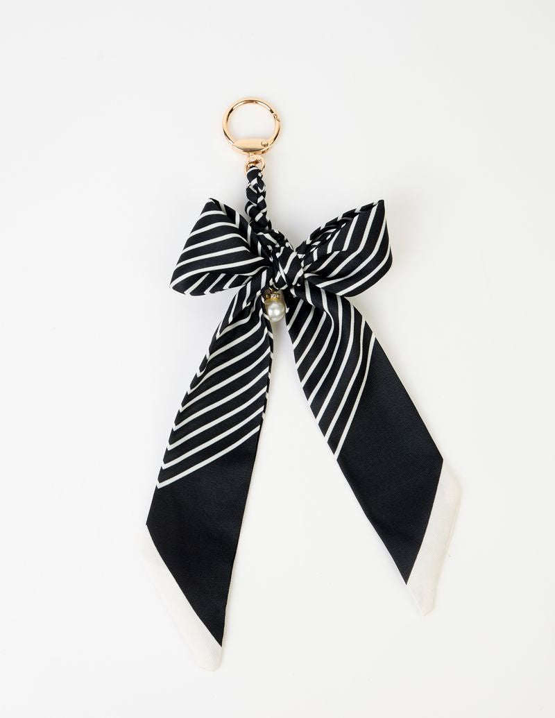 STELLA + GEMMA | KEY CHARM | STRIPE BOW

This cute bow keychain adds a playful touch to your everyday essentials. Clip it to your keys, handbag, or backpack for a fun little accessory that’s both stylish and impossible to lose.