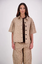 The N-E-S Demi Shirt is your ultimate summer must-have, blending a utilitarian edge with everyday versatility. Designed as a short-sleeve, boxy-fit shacket, it features a button-down front, single breast pocket, and elbow-length sleeves. Wear it open or closed—perfect for layering or styling solo through the warmer months.

Our model is 174cm and wear a XS/S (8-10)

Composition: Cotton, lycra

Designed and Made in New Zealand