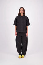 The N-E-S Demi Shirt is your ultimate summer must-have, blending a utilitarian edge with everyday versatility. Designed as a short-sleeve, boxy-fit shacket, it features a button-down front, single breast pocket, and elbow-length sleeves. Wear it open or closed—perfect for layering or styling solo through the warmer months.

Our model is 174cm and wear a XS/S (8-10)

Composition: Kale pop - cotton twill | Black - cotton, nylon

Designed and Made in New Zealand
