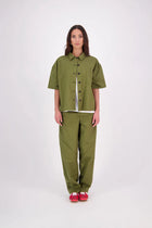 The N-E-S Demi Shirt is your ultimate summer must-have, blending a utilitarian edge with everyday versatility. Designed as a short-sleeve, boxy-fit shacket, it features a button-down front, single breast pocket, and elbow-length sleeves. Wear it open or closed—perfect for layering or styling solo through the warmer months.

Our model is 174cm and wear a XS/S (8-10)

Composition: Kale pop - cotton twill | Black - cotton, nylon

Designed and Made in New Zealand