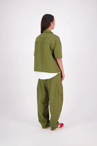 The N-E-S Demi Shirt is your ultimate summer must-have, blending a utilitarian edge with everyday versatility. Designed as a short-sleeve, boxy-fit shacket, it features a button-down front, single breast pocket, and elbow-length sleeves. Wear it open or closed—perfect for layering or styling solo through the warmer months.

Our model is 174cm and wear a XS/S (8-10)

Composition: Kale pop - cotton twill | Black - cotton, nylon

Designed and Made in New Zealand