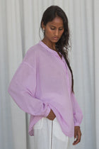 The LILLY PILLY EMBER Cotton Voile Shirt is made for warm, sun-drenched days. EMBER is crafted from sheer, featherlight 100% cotton voile that’s exceptionally breathable and quick to dry. Featuring a relaxed fit, placket details, and corozo buttons made from palm tree seeds, EMBER brings a touch of ease to any outfit, she’s the layer you’ll reach for all summer long.