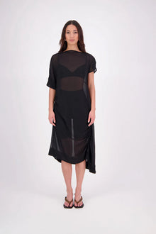 The N-E-S Em Dress is a statement style crafted in lightweight chiffon, designed with ruching and a drawcord that lets you adjust the length to suit your look. Featuring a cap sleeve on the left and a cuffed short sleeve on the right, it embraces asymmetry with a wide cuff hem for added edge. Floaty yet bold, the Em Dress is your go-to for elevated, directional dressing.

Our model is 174cm and wears a XS (8)
NES fit advise: Standard fit

Composition: PT Chiffon

Designed and Made in New Zealand