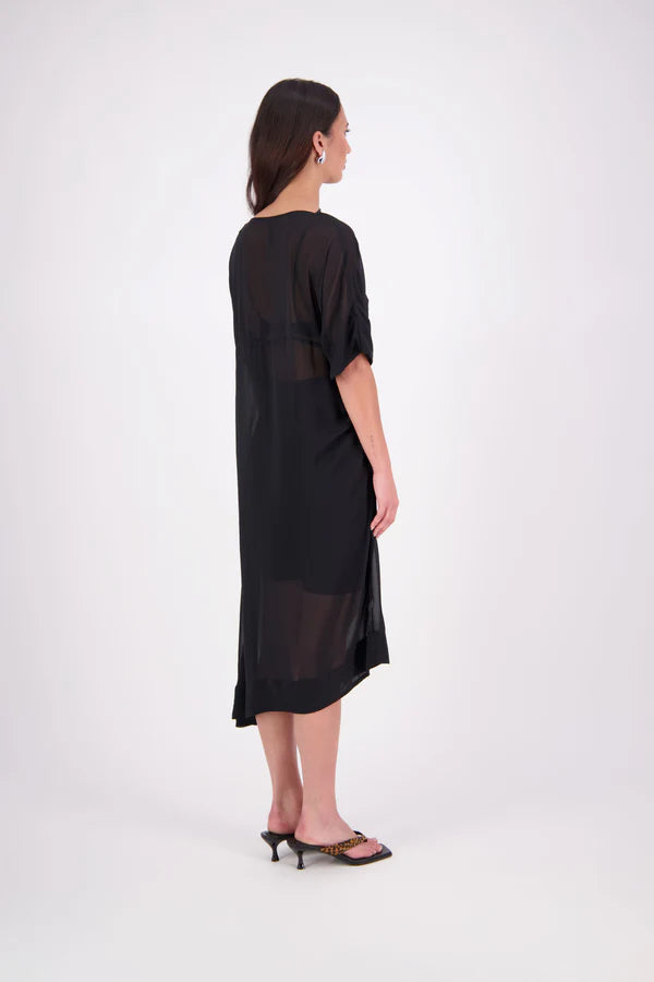 The N-E-S Em Dress is a statement style crafted in lightweight chiffon, designed with ruching and a drawcord that lets you adjust the length to suit your look. Featuring a cap sleeve on the left and a cuffed short sleeve on the right, it embraces asymmetry with a wide cuff hem for added edge. Floaty yet bold, the Em Dress is your go-to for elevated, directional dressing.

Our model is 174cm and wears a XS (8)
NES fit advise: Standard fit

Composition: PT Chiffon

Designed and Made in New Zealand