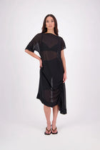 The N-E-S Em Dress is a statement style crafted in lightweight chiffon, designed with ruching and a drawcord that lets you adjust the length to suit your look. Featuring a cap sleeve on the left and a cuffed short sleeve on the right, it embraces asymmetry with a wide cuff hem for added edge. Floaty yet bold, the Em Dress is your go-to for elevated, directional dressing.

Our model is 174cm and wears a XS (8)
NES fit advise: Standard fit

Composition: PT Chiffon

Designed and Made in New Zealand
