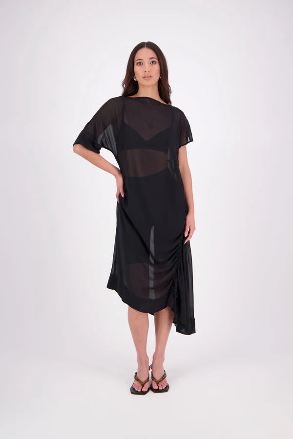 The N-E-S Em Dress is a statement style crafted in lightweight chiffon, designed with ruching and a drawcord that lets you adjust the length to suit your look. Featuring a cap sleeve on the left and a cuffed short sleeve on the right, it embraces asymmetry with a wide cuff hem for added edge. Floaty yet bold, the Em Dress is your go-to for elevated, directional dressing.

Our model is 174cm and wears a XS (8)
NES fit advise: Standard fit

Composition: PT Chiffon

Designed and Made in New Zealand
