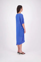 The N-E-S Em Dress is a statement style crafted in lightweight chiffon, designed with ruching and a drawcord that lets you adjust the length to suit your look. Featuring a cap sleeve on the left and a cuffed short sleeve on the right, it embraces asymmetry with a wide cuff hem for added edge. Floaty yet bold, the Em Dress is your go-to for elevated, directional dressing.

Our model is 174cm and wears a XS (8)
NES fit advise: Standard fit

Composition: PT Chiffon

Designed and Made in New Zealand