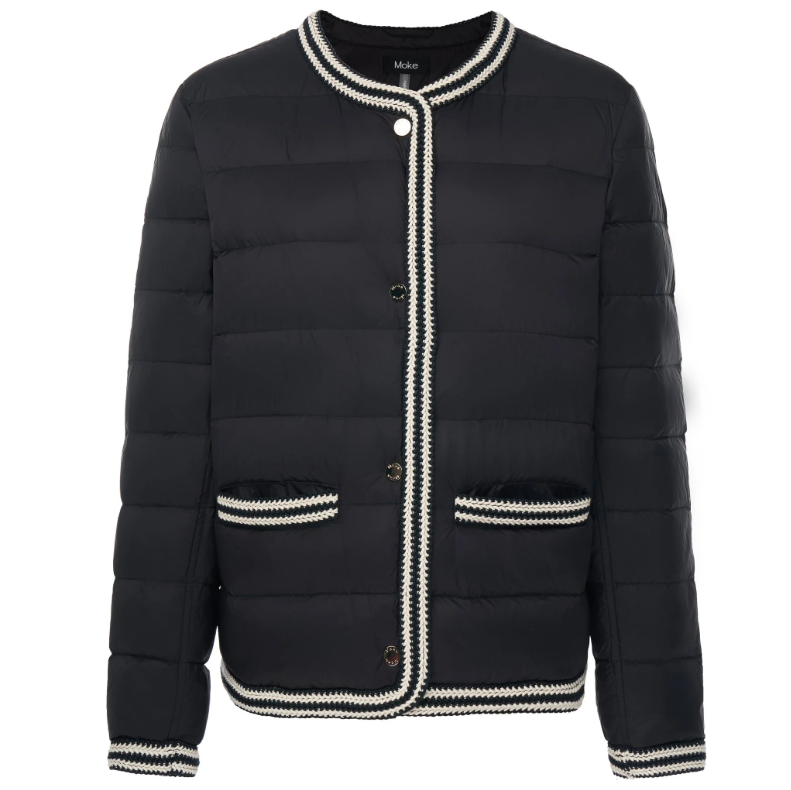 Fern by Moke women’s down puffer jacket in black and olive green. Bold, modern winter coat filled with 90 percent duck down and 10 percent waterfowl feathers for lightweight warmth. Features crochet knit trim at the hems and cuffs, exposed snap front closure with branded metal hardware, and a refined silhouette designed in New Zealand for elevated everyday cold weather wear.