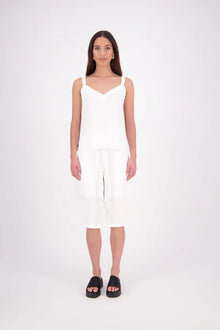 The N-E-S Rita Short is an easy update to our classic Gin Short, crafted in a breathable linen-cotton blend. Featuring a single front leg pleat for subtle shape, angled front pockets, and an elasticated back waistband for comfort. A decorative front drawcord adds detail, with a length finishing just below the knee—perfect for relaxed yet polished summer dressing.

White colourway has a 1/2 liner in a cotton voile
Our model is 174cm and wear a XS (8)
Composition: Linen Cotton
Designed and Made in New Zealand