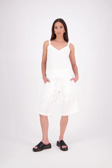 The N-E-S Rita Short is an easy update to our classic Gin Short, crafted in a breathable linen-cotton blend. Featuring a single front leg pleat for subtle shape, angled front pockets, and an elasticated back waistband for comfort. A decorative front drawcord adds detail, with a length finishing just below the knee—perfect for relaxed yet polished summer dressing.

White colourway has a 1/2 liner in a cotton voile
Our model is 174cm and wear a XS (8)
Composition: Linen Cotton
Designed and Made in New Zealand