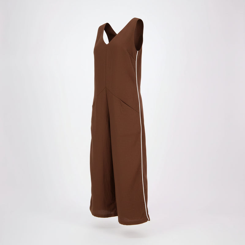 N-E-S Lounge Jumpsuit – Linen Cotton

Our best-selling N-E-S Lounge Jumpsuit is an effortless one-and-done piece designed to flatter all body shapes. Crafted in a breathable linen-cotton blend, it features tank-style straps, a subtle V-neckline, and a concealed side zip for ease. The curved front panel cleverly hides practical pockets, while the relaxed fit makes it the perfect trans-seasonal style