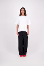 We’ve had some fun with our NES Gin Pants, adding a contrast side seam piping detail for a stylish twist on a classic design. These pants feature a flattering, classic cut that’s perfect for both dressing up and down, making them an ideal work pant and an effortless everyday style. With a flat front, covered elasticated back, and flattering angled pockets, they offer both comfort and sophistication.
Composition: 100% Polyester
Designed & Made in New Zealand