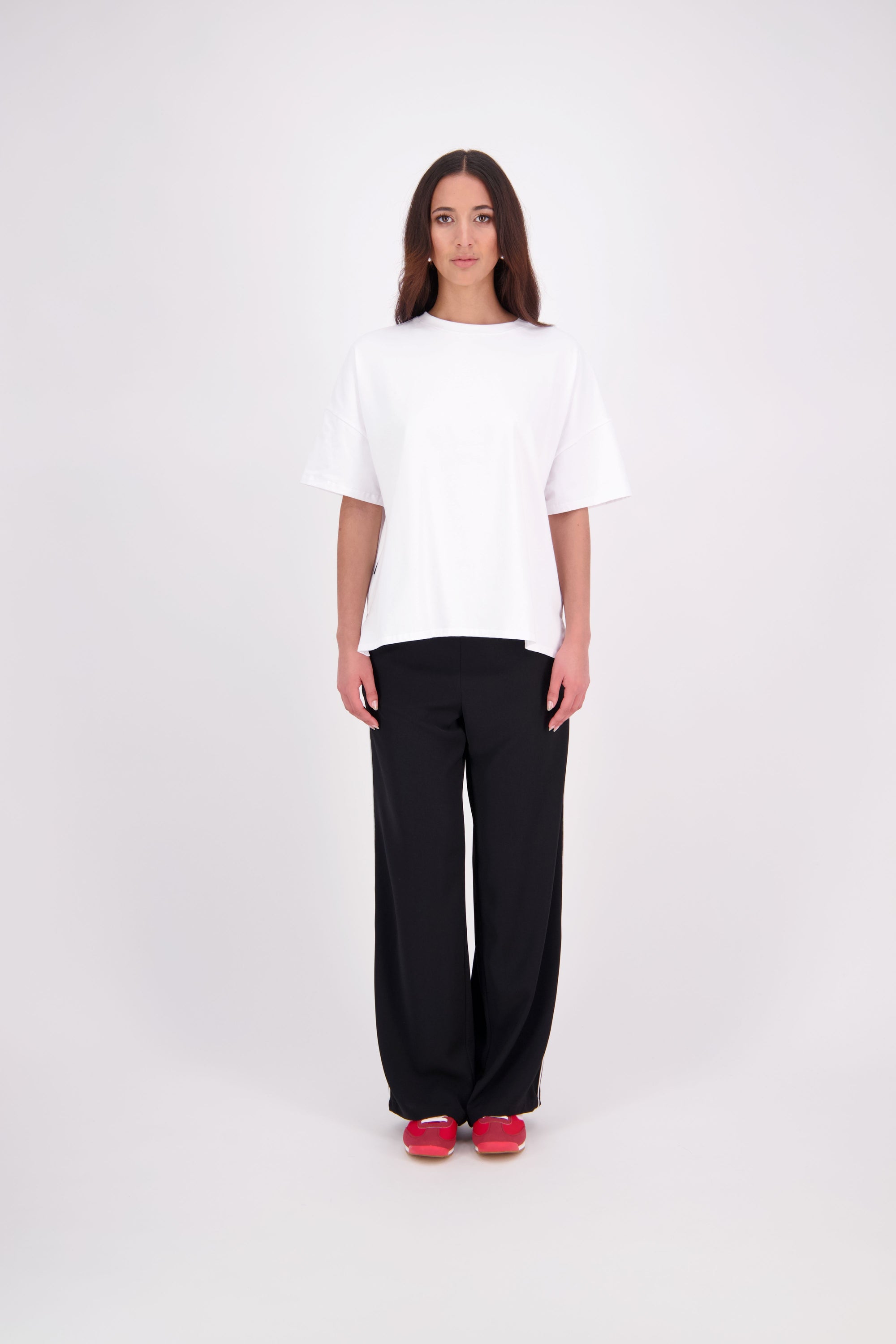 We’ve had some fun with our NES Gin Pants, adding a contrast side seam piping detail for a stylish twist on a classic design. These pants feature a flattering, classic cut that’s perfect for both dressing up and down, making them an ideal work pant and an effortless everyday style. With a flat front, covered elasticated back, and flattering angled pockets, they offer both comfort and sophistication.
Composition: 100% Polyester
Designed & Made in New Zealand