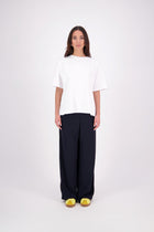 We’ve had some fun with our NES Gin Pants, adding a contrast side seam piping detail for a stylish twist on a classic design. These pants feature a flattering, classic cut that’s perfect for both dressing up and down, making them an ideal work pant and an effortless everyday style. With a flat front, covered elasticated back, and flattering angled pockets, they offer both comfort and sophistication.
Composition: 100% Polyester
Designed & Made in New Zealand