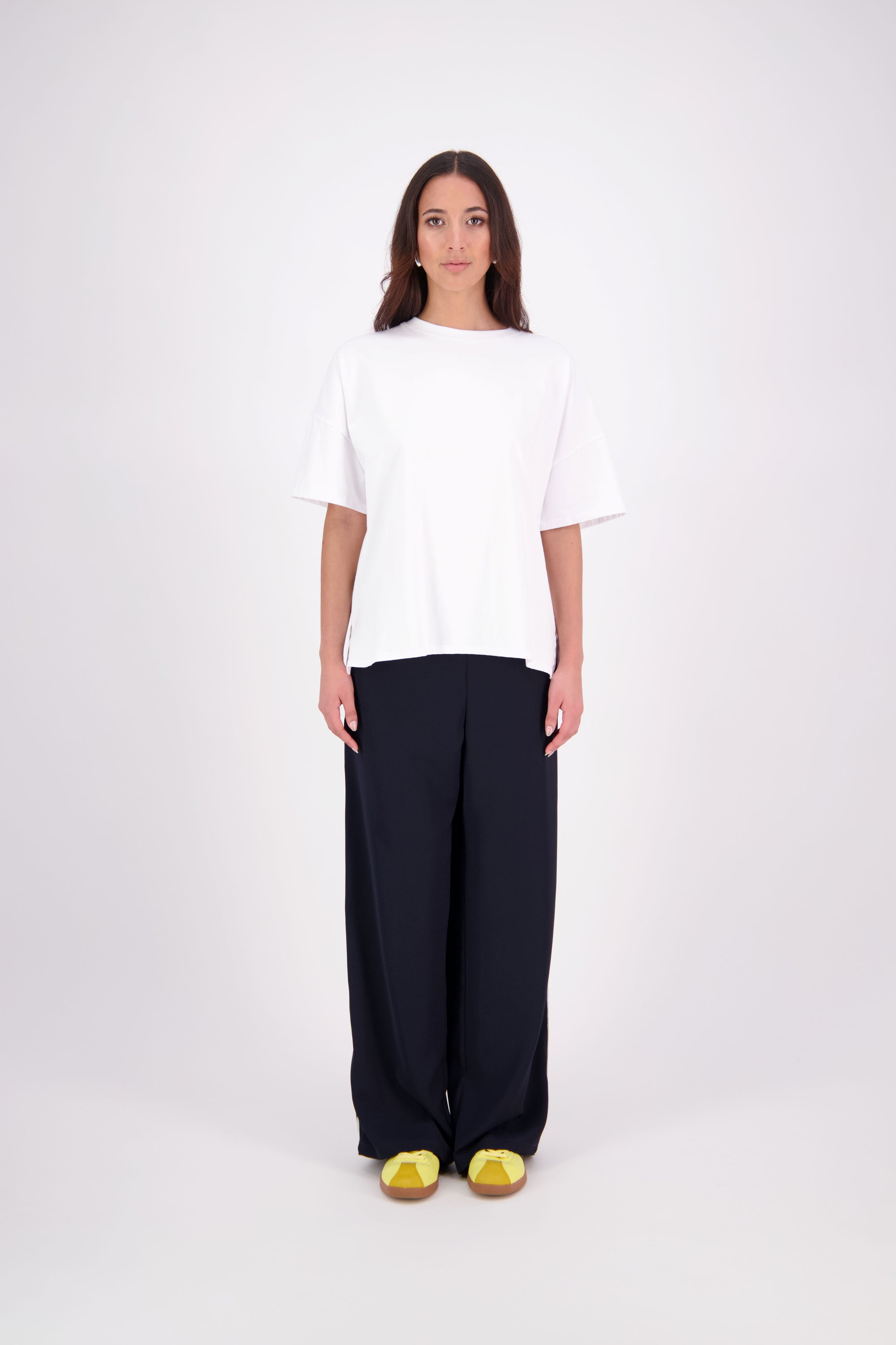 We’ve had some fun with our NES Gin Pants, adding a contrast side seam piping detail for a stylish twist on a classic design. These pants feature a flattering, classic cut that’s perfect for both dressing up and down, making them an ideal work pant and an effortless everyday style. With a flat front, covered elasticated back, and flattering angled pockets, they offer both comfort and sophistication.
Composition: 100% Polyester
Designed & Made in New Zealand