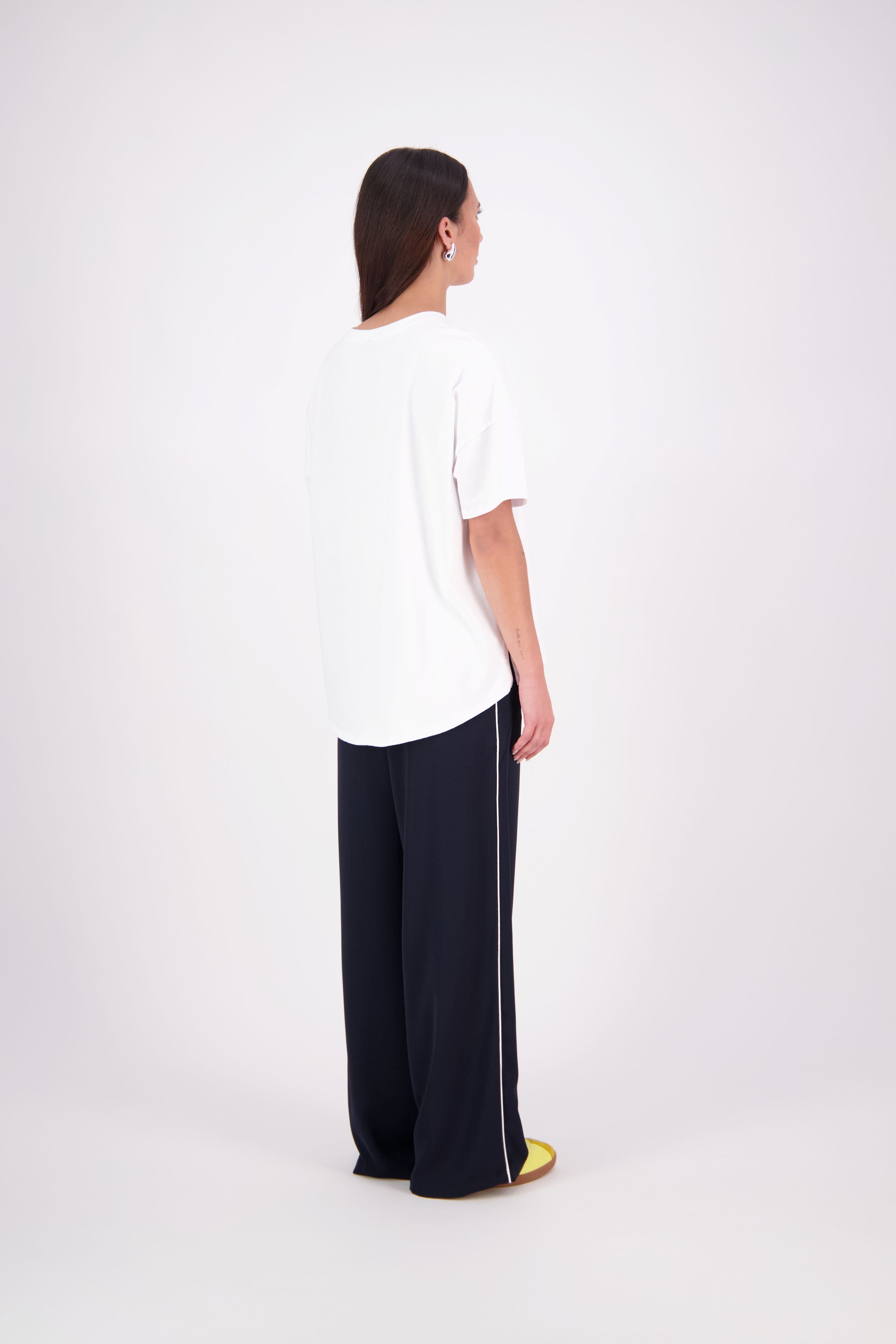 We’ve had some fun with our NES Gin Pants, adding a contrast side seam piping detail for a stylish twist on a classic design. These pants feature a flattering, classic cut that’s perfect for both dressing up and down, making them an ideal work pant and an effortless everyday style. With a flat front, covered elasticated back, and flattering angled pockets, they offer both comfort and sophistication.
Composition: 100% Polyester
Designed & Made in New Zealand