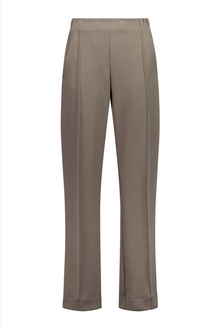 N-E-S Ginnie Pants, designed and made in NZ – women’s tailored pull-on pants with flat front, elasticated back waistband, angled side pockets, and centre front pin stitch on each leg; available in two-way stretch Latte or structured wool-Lycra Navy for polished everyday comfort.