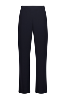 N-E-S Ginnie Pants, designed and made in NZ – women’s tailored pull-on pants with flat front, elasticated back waistband, angled side pockets, and centre front pin stitch on each leg; available in two-way stretch Latte or structured wool-Lycra Navy for polished everyday comfort.