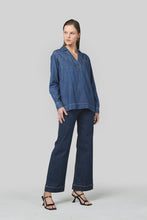 Load image into Gallery viewer, A slight drop shoulder denim shirt crafted in 6 oz Rigid denim. A straight, relaxed silhouette. It boasts a V collar and Straight hem.&nbsp;

Model wears a size 8 and is 176cm tall

Composition: 100% Cotton

BRAND: Dricoper
