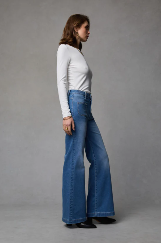 Indy Rodeo Wide Leg Jean by Dricoper in rodeo-blue stretch denim, featuring a high-rise waist, relaxed wide-leg silhouette, and statement patch pockets. Made from 99% cotton and 1% elastane for comfortable stretch. Model is 176cm tall and wears a size 8/Small.