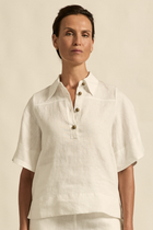 The Insinuate top from Zoe Kratzmann is elevated simplicity, reimagined. This top blends contemporary classics with soft femininity, making it a versatile hero for trans-seasonal outfitting. see product details below.
crafted in 100% linen
crisp collar offers structure and sophistication
flutter sleeve adds subtle volume and movement
brass domed buttons for modern polish
refined, versatile style perfect for effortless layering
pair with the apex pant in porcelain for trans-seasonal styling