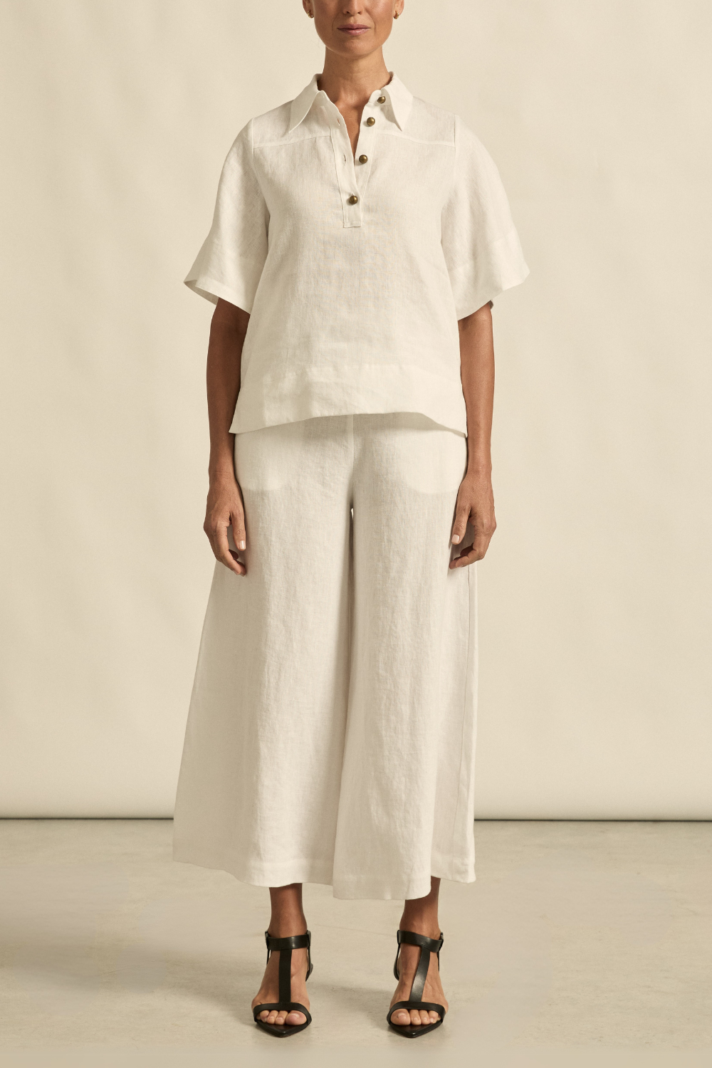 The Insinuate top from Zoe Kratzmann is elevated simplicity, reimagined. This top blends contemporary classics with soft femininity, making it a versatile hero for trans-seasonal outfitting. see product details below.

crafted in 100% linen
crisp collar offers structure and sophistication
flutter sleeve adds subtle volume and movement
brass domed buttons for modern polish
refined, versatile style perfect for effortless layering
pair with the apex pant in porcelain for trans-seasonal styling