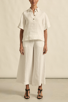 The Insinuate top from Zoe Kratzmann is elevated simplicity, reimagined. This top blends contemporary classics with soft femininity, making it a versatile hero for trans-seasonal outfitting. see product details below.

crafted in 100% linen
crisp collar offers structure and sophistication
flutter sleeve adds subtle volume and movement
brass domed buttons for modern polish
refined, versatile style perfect for effortless layering
pair with the apex pant in porcelain for trans-seasonal styling