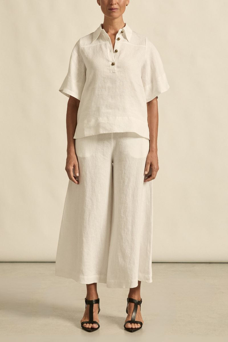 The Insinuate top from Zoe Kratzmann is elevated simplicity, reimagined. This top blends contemporary classics with soft femininity, making it a versatile hero for trans-seasonal outfitting. see product details below.

crafted in 100% linen
crisp collar offers structure and sophistication
flutter sleeve adds subtle volume and movement
brass domed buttons for modern polish
refined, versatile style perfect for effortless layering
pair with the apex pant in porcelain for trans-seasonal styling