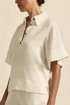 The Insinuate top from Zoe Kratzmann is elevated simplicity, reimagined. This top blends contemporary classics with soft femininity, making it a versatile hero for trans-seasonal outfitting. see product details below.

crafted in 100% linen
crisp collar offers structure and sophistication
flutter sleeve adds subtle volume and movement
brass domed buttons for modern polish
refined, versatile style perfect for effortless layering
pair with the apex pant in porcelain for trans-seasonal styling