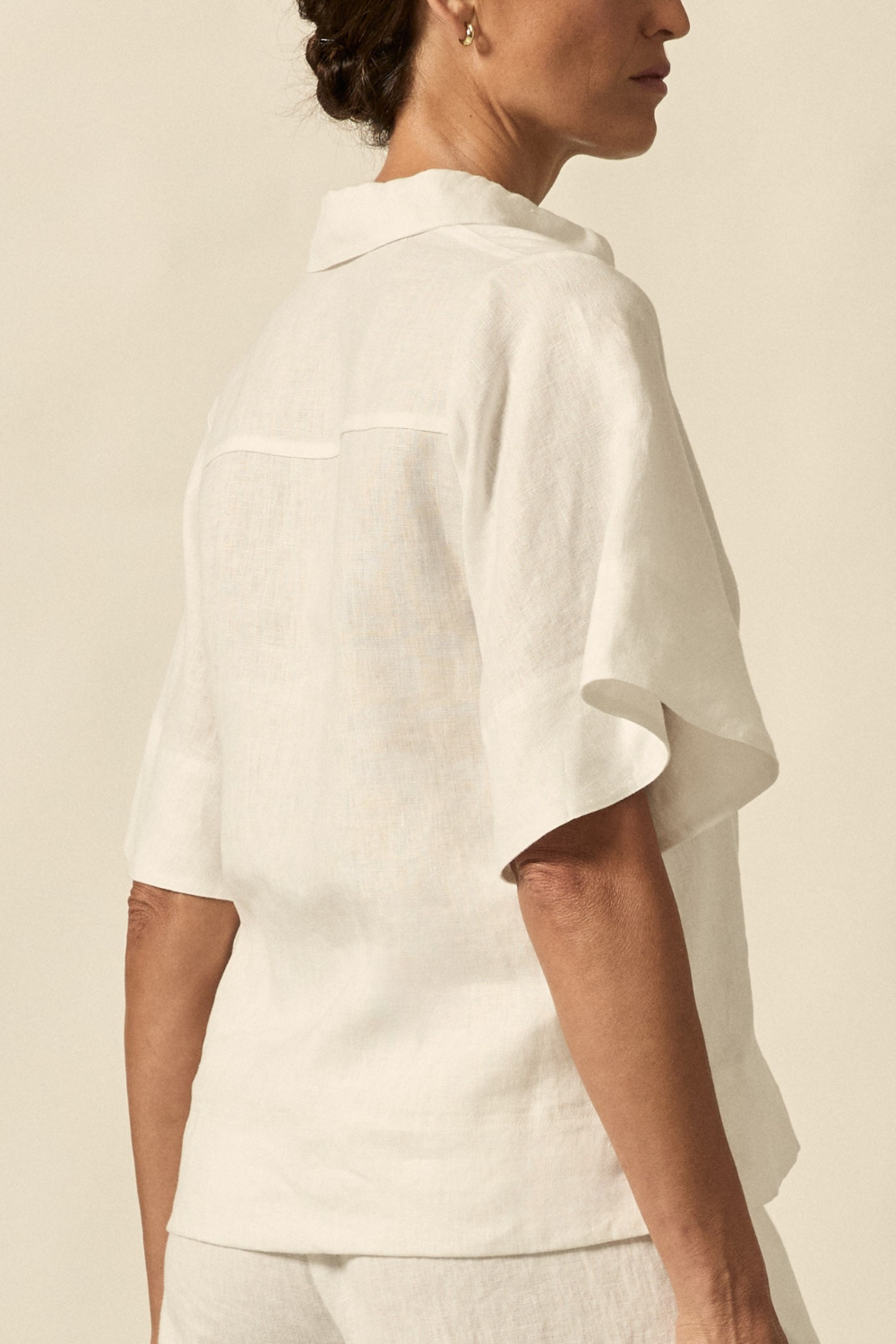 The Insinuate top from Zoe Kratzmann is elevated simplicity, reimagined. This top blends contemporary classics with soft femininity, making it a versatile hero for trans-seasonal outfitting. see product details below.

crafted in 100% linen
crisp collar offers structure and sophistication
flutter sleeve adds subtle volume and movement
brass domed buttons for modern polish
refined, versatile style perfect for effortless layering
pair with the apex pant in porcelain for trans-seasonal styling