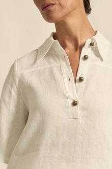 The Insinuate top from Zoe Kratzmann is elevated simplicity, reimagined. This top blends contemporary classics with soft femininity, making it a versatile hero for trans-seasonal outfitting. see product details below.

crafted in 100% linen
crisp collar offers structure and sophistication
flutter sleeve adds subtle volume and movement
brass domed buttons for modern polish
refined, versatile style perfect for effortless layering
pair with the apex pant in porcelain for trans-seasonal styling