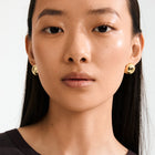 Add a retro twist to your style with Pilgrim's JACE earrings. Available in gold-plated &amp; silver-plated,
Trendy bubble dome design
Measures 20mm in diameter
A touch of vintage coolness
Crafted from 99% recycled materials