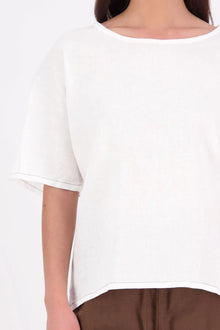 A relaxed, easy-to-wear staple, 
the N-E-S Jasmine Top is now crafted in a breathable linen-cotton blend for added softness and comfort. This boxy, multi-seasonal style features a beautifully bound neckline in self fabric, with contrast topstitch detailing on the hem lines (hem and sleeve hem). A versatile wardrobe essential with an elevated finish. linen/cotton blend. Designed & made in NZ