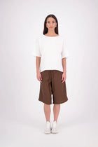 A relaxed, easy-to-wear staple, 
the N-E-S Jasmine Top is now crafted in a breathable linen-cotton blend for added softness and comfort. This boxy, multi-seasonal style features a beautifully bound neckline in self fabric, with contrast topstitch detailing on the hem lines (hem and sleeve hem). A versatile wardrobe essential with an elevated finish. linen/cotton blend. Designed & made in NZ