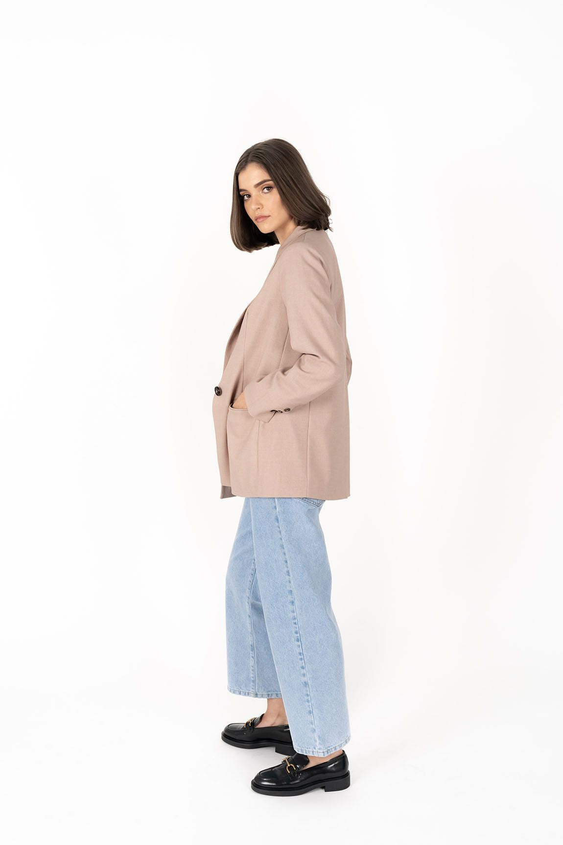 The Cosmo Blazer will instantly add effortless sophistication to any outfit! Lightweight enough to not feel heavy or restrictive but will still provide that extra layer of warmth. We love wearing her with jeans and a white tee for a chic weekend look, or pair with a pant or skirt to create a classic suit for days in the office.

Smart casual blazer with a soft, boxy silhouette.
Small subtle shoulder pads.
Lined collar with fold back lapel.
Lightweight, soft, stretch fabric with beautiful drape.
Functional p