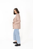The Cosmo Blazer will instantly add effortless sophistication to any outfit! Lightweight enough to not feel heavy or restrictive but will still provide that extra layer of warmth. We love wearing her with jeans and a white tee for a chic weekend look, or pair with a pant or skirt to create a classic suit for days in the office.

Smart casual blazer with a soft, boxy silhouette.
Small subtle shoulder pads.
Lined collar with fold back lapel.
Lightweight, soft, stretch fabric with beautiful drape.
Functional p
