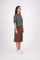 The N-E-S Rita Short is an easy update to our classic Gin Short, crafted in a breathable linen-cotton blend. Featuring a single front leg pleat for subtle shape, angled front pockets, and an elasticated back waistband for comfort. A decorative front drawcord adds detail, with a length finishing just below the knee—perfect for relaxed yet polished summer dressing.

White colourway has a 1/2 liner in a cotton voile
Our model is 174cm and wear a XS (8)
Composition: Linen Cotton
Designed and Made in New Zealand