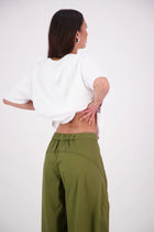 The N-E-S Demi Pant brings a fresh utilitarian feel to everyday dressing, featuring the much-loved Gin Pant upper. With a side seam zip, elasticated back waistband for comfort, and front pockets, it’s finished with barrel-style seams that taper at the hem for a flattering shape. Contrast topstitching adds a bold, modern touch. An easy-wearing style designed for movement and versatility.Composition: Kale pop - cotton twill | Black - cotton, nylon. designed & made in NZ