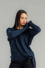 Load image into Gallery viewer, The NES Merino Leisure Tie Top is a stylish and versatile piece, perfect for pairing with your favourite denim, Dolly B pants, Drilled Gin pants, or the Ribs skirt. This top features a self-tie at the side that can be adjusted to your liking—tied tight for a more structured look or looped loose for a relaxed feel. With its batwing design and cigarette sleeves, it offers a flattering silhouette that adds slimness to your lower arms while providing maximum comfort. 100% merino
