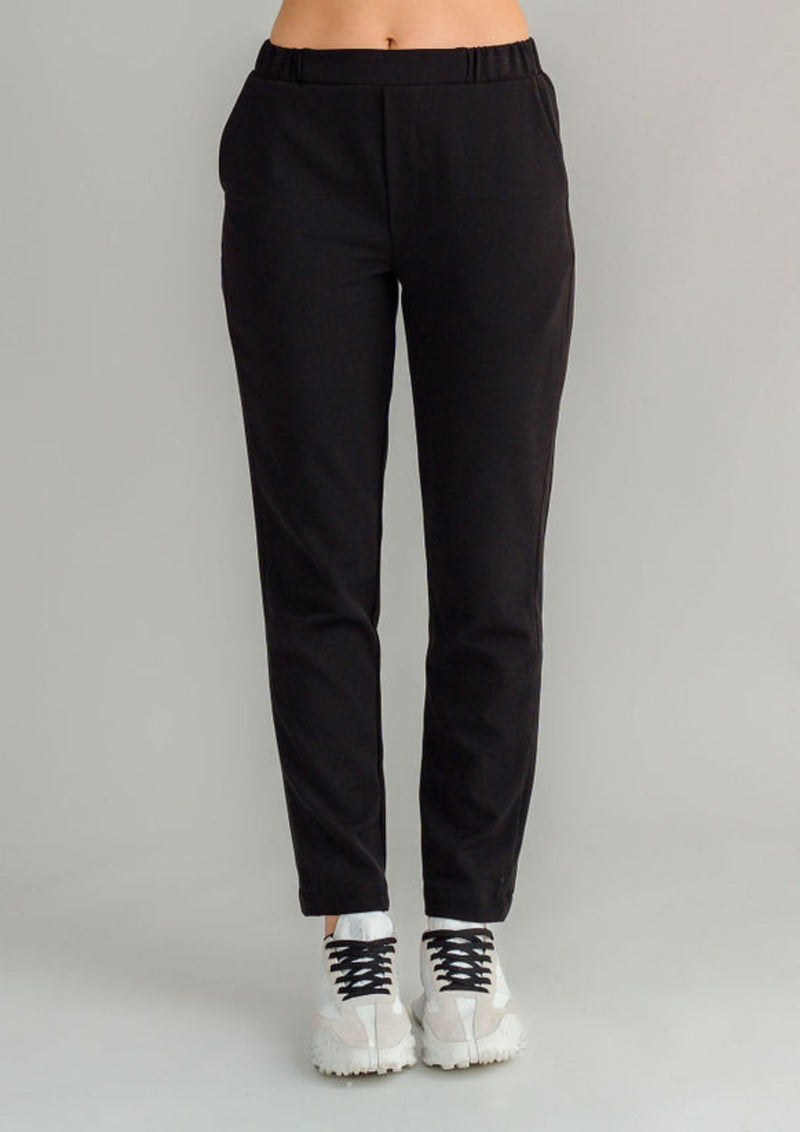 The NES Lilly Pant is a fresh new style designed for both comfort and impact. Featuring a sleek straight leg in a flattering 7/8 length, this pant is elevated with a bold racer-style contrast stripe along the side seam. Thoughtfully detailed with a curved back yoke, faux front fly, and side seam pockets, the Lilly Pant combines structure with everyday ease. The elasticated waistband and soft 2-way stretch fabric ensure a comfortable, flexible fit, making it an effortlessly versatile piece