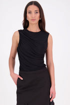 The N-E-S Lyla Mesh Tank is a sheer take on our popular Eva Tank, designed in a soft, stretch mesh. Featuring front ruching and a double-layered front for added coverage, this style falls just below the waistband for a flattering, easy-to-style fit. Perfect for layering or wearing as a statement on its own.